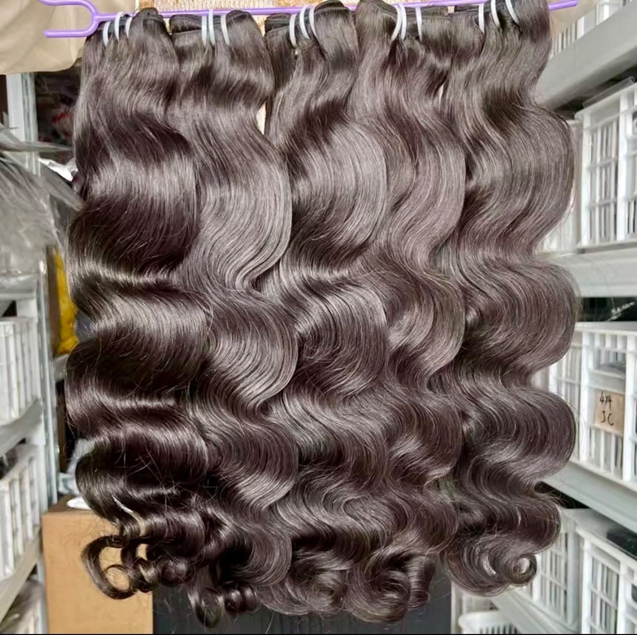 Glossy body wave bundles displayed together